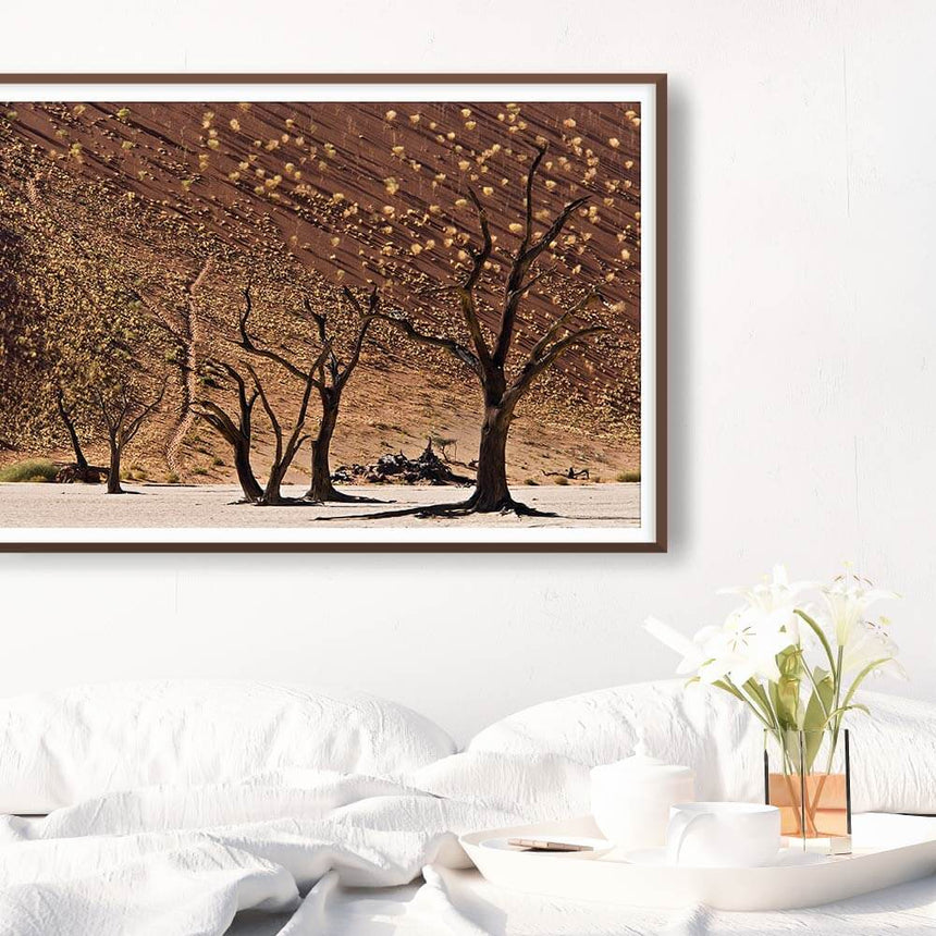 Fine art photographic print by Jonathan and Angela Scott, depicting dead trees in a salt pan in Sossusvlei, Namibia.