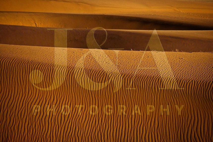 Fine art photographic print by Jonathan and Angela Scott, depicting ripples of sand in the dunes of Sossusvlei, Namibia.